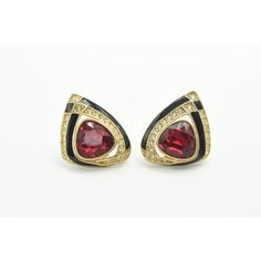 Large 1980s gold tone clip on earrings featuring a black enamel ribbon with a large red rhinestone in the center and white prong set rhinestones ribbon as well.  Signed Craft for Gem Craft. Enamel Clip-on Earrings For Evening, Formal Enamel Clip-on Earrings, Gem Crafts, Red Rhinestone, Gold Enamel, Black Enamel, Clip On, Prong Setting, Clip On Earrings