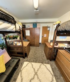 a room with bunk beds, desks and other items in the room that is used as a dorm