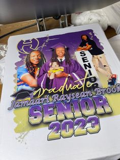 a table with a sign on it that says graduate jamari raygan brown senior year 2012