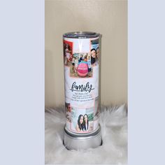 a can with pictures on it sitting on top of a white furnishing area