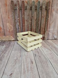 a wooden crate sitting on top of a wooden floor