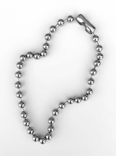 The necklace you didn't know you needed until now - made with stainless steel, the 'XL' ball chain is bound to be your new everyday staple! With its versatility, this piece can be layered with pearls, pendant chains, or worn on its own to complete any outfit! Made with stainless steel chain. Waterproof and rust-free. Available in lengths 14", 15", 16", 18", 20". Model is wearing 16". Handmade in Los Angeles. Silver Ball Chain Necklace In Stainless Steel, Silver Ball Chain Necklace For Everyday, Everyday Silver Ball Chain Necklace, Silver Dog Tag Necklace With Ball Chain, Silver Dog Tag Ball Chain Necklace, Metal Chain Necklace With Ball Chain And Round Beads, Ball Chain Necklace, Creating Jewelry, Chain Necklaces