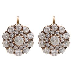 Center Stone: 42 Diamonds Cut: Old Mine Cut Weight: 6.06 Carats Color: I-J Clarity: SI Metal: 18K Yellow Gold Era: Modern Circa: 2020's in theAntique Style Hallmarks: Stone Weight Engraved Size: 7/8 x 5/8 inches Gram weight: 5.48 These elegant earrings feature 42 dazzling old mine cut diamonds, totaling 6.06 carats. The diamonds, with their I-J color and SI clarity, are set in 18K yellow gold, offering a timeless and sophisticated look. Crafted in the modern era but styled to reflect antique cha Earring Video, Yellow Gold Drop Earrings, Vintage Drop Earrings, Yellow Gold Earrings, Antique Inspiration, Antique Earrings, Yellow Gold Earring, Cluster Earrings, Gold Drop Earrings