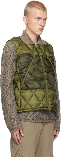 Lightweight down-filled and quilted nylon micro-ripstop vest. Elasticized trim throughout. · Y-neck · Pull-tabs at two-way zip closure · Reinforced panel at zip pockets · Reflective logo printed at front · Bungee-style drawstring at hem · Patch pockets at interior · Fully lined Supplier color: Olive branch Fill: 90% white duck down, 10% white duck feather. Functional Nylon Vest With Zipper Closure, Outdoor Nylon Vest With Zipper Closure, Quilted Nylon Functional Vest, Functional Quilted Nylon Vest, Nylon Vest With Zipper Closure For Streetwear, Outdoor Quilted Down Vest, Light Down, Duck Feather, White Duck