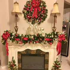 a fireplace decorated for christmas with red and green decorations