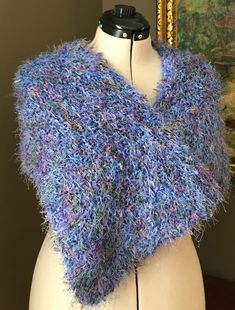 "Hand Knit, gently pre-worn, wrap around shawl. Feathery feel. Like new.  Machine washed delicate cycle. Lay flat to dry.  Drape over the shoulder loosely or close with a brooch or shawl pin. Dimensions: 11\" x 39\" Lightweight. Made in the 90's, pre-2000." Blue Crochet Yarn Shawl, Blue Crochet Shawl One Size, Hand Knitted Blue Shawl For Winter, Hand Knitted Blue Shawl One Size, Blue Hand Knitted Winter Shawl, Hand Knitted Blue Winter Shawl, Blue Hand Knitted Scarf, Purple Scarf, Shawl Pin