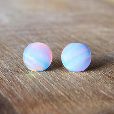 Our affordable Opal studs boast all the colors of the rainbow!  Made from a new kind of synthetic opal which can change color completely depending on light.  Due to the nature of the material every piece is unique.  #opaljewelry #opalearrings #rainbow #woodallgood Minimalist Hypoallergenic Opal Earrings, Minimalist White Opal Earrings, Opal Earrings As Gift, Dainty Hypoallergenic Opal Earrings, Minimalist Opal Earrings For Gift, Minimalist Opal Earrings As Gift, Hypoallergenic Opal Round Earrings, Hypoallergenic Opal Earrings For Gift, Minimalist Opal Earrings