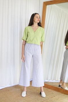 Light, bright and fun the Caroline Blouse will become your go to gal to add a pop of colour to any outfit. Handmade in the softest textured cotton, in a fresh shade of green, kiwi.With a v-neckline buttoning closed down the front, fun puff sleeves and cropped to the waist. Relaxed fit sits perfectly on it's own or tied up for a little more shape.Features: - 100% Textured Cotton - 140gsm- Button through the front - Handmade in Byron Bay, AustraliaModel is 5'9 and wears an XS. Cotton V-neck Blouse For Loungewear, Relaxed Fit Puff Sleeve Peasant Top For Spring, Cotton Peasant Top With Puff Sleeves, Cotton Puff Sleeve Peasant Top For Day Out, Cotton Peasant Top With Puff Sleeves For Day Out, Spring Cotton Peasant Top For Day Out, Spring Puff Sleeve Tops For Loungewear, Casual Puff Sleeve Loungewear Tops, Relaxed Fit Cotton Peasant Top For Day Out