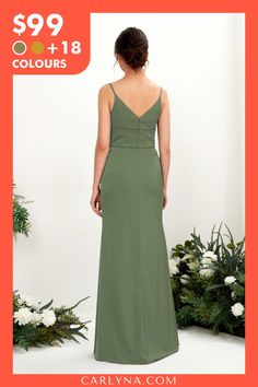 a woman in a long green dress is looking back