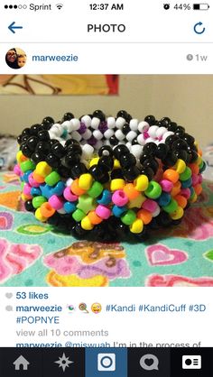 a bunch of bracelets that are on top of a table with an instagramr