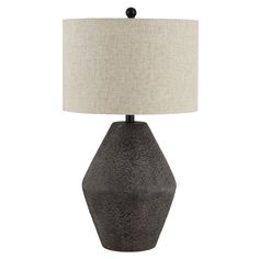 a black table lamp with a white shade on it and a beige linen lampshade