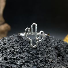 🐬Product Name:Hollow Cactus Ring 🐬Material：Silver 🐬Band color：Silver 🐬Style：party,rock,hiphop 🐬Personalized：Yes 🐬Recycled：Yes 🐬Occasion : Anniversary / Daily / Wedding / Gift / Party/birthday/Valentine's Day/Engagement/Mother's Day/Father's Day 🐬Metal:Silver 🐬Metal Color:Silver 🐬Style:Art Decor,Hiphop,Vintage,party,dance 🐬About Size:Height: about 1.38 cm Thickness: about 0.14 cm Width: about 0.18 cm We can provide personalize ring sizes of 7-12 US size# if you need other sizes# please Plant Ring, Cactus Ring, Plant Rings, Party Rock, Vintage Party, Ring Minimalist, Handmade Rings, Silver Style, Personalized Rings