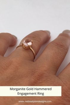 a woman's hand with a ring on it and the words morganite gold hammered engagement