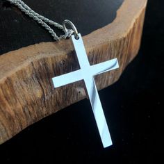 Men's Fine Silver Plain Cross Pendant NecklaceSolid 999 file silver.Minimalist design.Mirror polished.Ideal gift for him on birthdays and Christmas. Product DetailsMetal Type: 999 Fine SilverColor: SilverGender: MaleAge Group: AdultPendant Size: 26 mm (w) * 45 mm (h) * 4 mm (t)Pendant Weight: 10.1 gChain Type: Sterling Silver Rope ChainChain Width: 1.3 mmLength: 18 in / 20 in / 22 in / 24 in / 26 in / 28 in / 30 inPaymentFor the safety of your funds, we only accept PayPal payments.You can pay with a credit card through PayPal, even if you don't have a PayPal account.Please see our Payment page for details.ShippingUSA - USPS, 5-7 business days, $5Worldwide - EMS, 10-20 business days, $5FREE SHIPPING on orders over $49.Please see our Shipping page for details. Return30 Days Money Back Guaran Men Pendant, Design Mirror, Sterling Silver Mens, Cross Pendant Necklace, Rope Chain, Fine Silver, Cross Pendant, Gift For Him, Types Of Metal