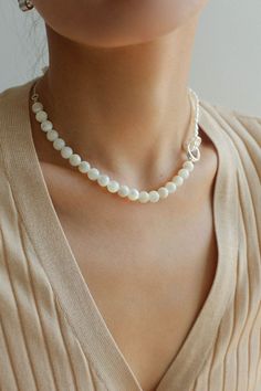 This stunning necklace features an elegant blend of 8mm natural white mother-of-pearl and delicate millet pearls, creating a chic half-and-half design that is both eye-catching and fashionable. With its sophisticated yet modern aesthetic, this piece brings an air of elegance and grace to any outfit. Whether paired with a dress, blazer, or knitwear, it adds a soft and refined touch, making it the perfect accessory for a variety of styles. Metal: Recycled Sterling Silver Plated On Brass Material: Elegant Single Strand Mother Of Pearl Necklace, Elegant Mother Of Pearl Necklace With Pearl Drop, Feminine White Pearl Chain Necklace, Elegant Polished Bead Necklaces, Elegant Pearl Chain Necklace With Mother Of Pearl, Elegant Pearl Chain Necklace In Mother Of Pearl, Chic Pearl Necklace With Pearl Charm, Elegant Mother Of Pearl Necklace With Pearl Chain, Elegant Mother Of Pearl Necklace