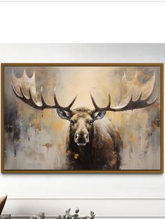 a painting of a moose with large antlers on it's head is hanging in a living room