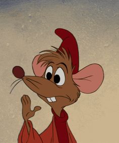 a cartoon mouse wearing a red robe and smiling at the camera with his hand up in front of him