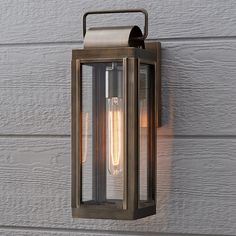 an outdoor light on the side of a house