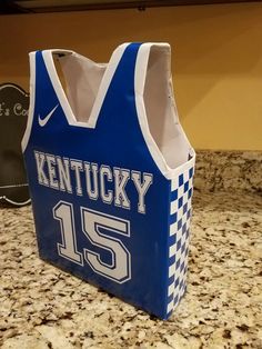 a kentucky basketball jersey bag sitting on top of a counter