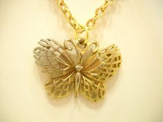 "Vintage gold tone & silver tone butterfly pendant necklace. 18\" gold tone chain attached to a 1\" x 1 1/4\" butterfly pendant. Excellent condition. Unsigned." Nickel Free Gold Butterfly Necklace, Gold Butterfly Chain Jewelry, Vintage Gold Butterfly Jewelry, Gold-plated Gold Butterfly Necklace, Yellow Gold Plated Butterfly Necklace, Gold Metal Butterfly Necklace, Vintage Gold Jewelry With Butterfly Clasp, Elegant Metal Butterfly Pendant Necklace, Sterling Silver Yellow Gold Butterfly Pendant Necklace