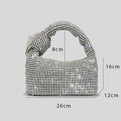 This Rhinestone bag is an Everyday Silver Purse its a must-have accessory for any stylish individual. Its handcrafted design boasts a lustrous silver finish, adding a touch of sophistication to any outfit. Made with high-quality materials, this purse is durable and practical, providing both fashion and function. Rhinestone Bag, Rhinestone Handbags, Silver Purse, Crystal Top, Compact Bag, Stylish Scarves, Hair Adornments, Love And Co, Luxury Designer Handbags