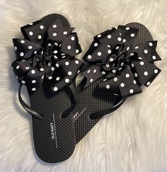 A pair of Old Navy flip flops decorated with a black grosgrain ribbon adorned with white polka dots. Ribbons are hand sewn to the shoe by me!! Super cute and fun!! Great for poolside or the beach, adorable for anywhere!! Three loops of one and a half inch ribbon made into a pinwheel bow that measures approximately 5 inches wide. Ends are heat sealed for no fraying. I'll be coming out with more colors soon so come back and visit!! Thank you for stopping by!! Custom requests are always welcome. Pl Casual Summer Flip Flops With Bow, Cute Bow Sandals For The Beach, Adjustable Black Summer Flip Flops, Adjustable Bow Sandals For Beach, Summer Beach Flip Flops With Bow, Black Bow Sandals For Summer, Summer Bow Flip Flops With Open Toe, Adjustable Bow Sandals For Vacation, Fun Black Flip Flops For Summer