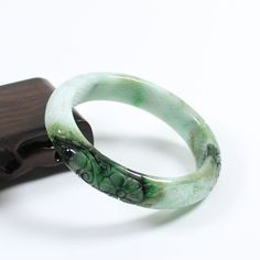 56mm Certified A Natural Green Carving Burma Jadeite Jade Bangle Bracelet 4873   Inside diameter * Width : 55.6 * 12.9 mm Weight : 53.83 g Density : 3.33 g/cm³ Payment:     We accept PayPal only, please confirm your address on eBay before you pay for your item, and we only ship to the address you left on eBay, hope you can understand.     If you had any question, please contact us via eBay message, we will respond you ASAP. Return Policy:     We offer a 14 days money-back guarantee.     If you decide to return it, please contact us and send it back within 30 days after receipt, in its original condition (including the packing materials) Thank you very much, hope you can have a nice shopping expericece. Payment Payment  WELCOME&FEEDBACK RATING: Hi my friend,we serve customer wholeheartedly Spiritual Style Jade Bangle Jewelry, Green Spiritual Bangle As A Gift, Spiritual Green Bangle As A Gift, Spiritual Jade Bangle For Gift, Adjustable Green Jade Bangle, Handmade Green Jade Bangle, Carved Jade Bangle Bracelet, Carved Jade Bangle As A Gift, Green Carved Bracelet As A Gift