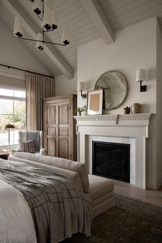 a bedroom with a fireplace and bed in it