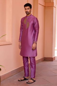 Wine kurta with marodi dori embroidery along the placket. Paired with a pant. - Aza Fashions Purple Long Sleeve Traditional Wear With Embroidered Border, Purple Kurta With Embroidered Border For Eid, Semi-stitched Purple Kurta With Embroidered Border, Purple Raw Silk Kurta For Eid, Eid Purple Raw Silk Kurta, Embroidered Purple Kurta With Traditional Drape, Transitional Purple Kurta With Zari Work, Embroidered Purple Traditional Wear For Ceremonial Use, Purple Kurta With Traditional Drape For Transitional Season