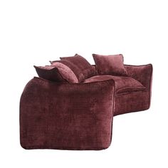 a purple couch with pillows on top of it