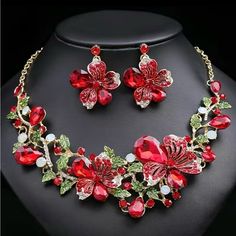 Brand New. Red. Striking Necklace And Earring Set From Jane Chic Designs. Beautiful Flower Design With Inlaid Rhinestones. This Is A Must Have Statement Piece. This Is Perfect For Weddings, Parties, Or Any Other Special Occasion. Great Gift For Birthdays, Mother’s Day, Or Any Other Special Celebration. Made Of High Quality Alloy And Crystal. It Is Easy And Comfortable To Wear. Red Jeweled Jewelry For Valentine's Day, Red Jewels Jewelry For Valentine's Day, Red Jeweled Valentine's Day Jewelry, Red Costume Jewelry For Valentine's Day, Red Valentine's Day Jewelry, Red Crystal Jewelry Sets For Valentine's Day, Red Crystal Jewelry With Matching Earrings, Red Jewelry Set With Jewels For Gift, Red Jewelry Sets For Gifts