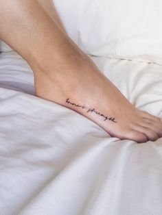 a person's foot with a tattoo that reads, i love my wife on it