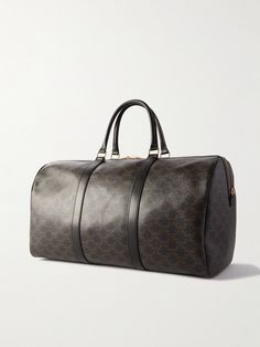 CELINE HOMME's 'Sac De Voyage' weekend bag is the perfect travel companion. It's been crafted in Italy from hardwearing coated-canvas and printed with the house's unmistakable 'Triomphe' monogram. Finishing touches include supple leather trims, gold-tone accents and a secure padlock fastening. Large Capacity Monogram Canvas Travel Bag, Top Handle Bag In Signature Coated Canvas For Travel, Top Handle Signature Coated Canvas Bag For Travel, Top Handle Bag In Coated Canvas For Travel, Top Handle Travel Bag In Signature Coated Canvas, Signature Coated Canvas Top Handle Travel Bag, Travel Bag With Gold-tone Hardware And Coated Canvas, Travel Bag With Gold-tone Hardware And Signature Coated Canvas, High-end Travel Bag With Dust Bag