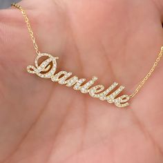 This unique personalized script font nameplate cut-out necklace is composed of 14K solid gold and beautifully pavé set with genuine GVs1 quality natural real Diamonds. This pendant is complemented by a durable 14K solid gold adjustable chain or can be purchased as a charm alone without the chain under the "Length" drop-down menu. NOTE: The item will be made in the exact casing of the characters entered. Please be mindful of this detail when providing the customization desired. Name Dimensions: a 4 Characters, Solid Gold Necklace, Script Font, Real Diamonds, Jewelry Gift Box, Name Plate, Pave Diamonds, Heart Necklace, Solid Gold