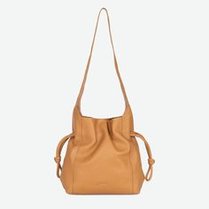 "Our newest drawstring is made of soft grain leather that cinches to create a refined and sophisticated shoulder bag that will take you from day to evening. The Seneca is roomy enough for your life necessities and comes in a classic palette that will carry you through all seasons. 12\" H 11\" W 4\" D 13\" Drop   100% Full Grain Leather Cotton Lining + Magnetic Closure Interior Zipper Back Exterior Pocket Fits Up to a 13\" Laptop Includes dust bag" Life Necessities, Drawstring Shoulder Bag, Magnetic Closure, Full Grain Leather, All Seasons, Tan Leather, Drawstring Bag, Drawstring Backpack, Purses And Handbags