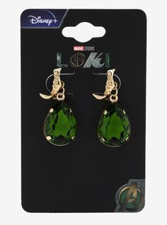 the avengers earrings are green and have gold charms on them, with an image of loki's head hanging from it