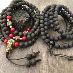 Everyday black lava stone mala necklace. You can choose between 2 styles. 1- A Mala necklace that is all black lava stones which is 43cm- 17 inch long (there is no clasp, you wear it over the head) 2-A Mala necklace which has black lava stones, red beads and unique Nepali beads. This Mala is 48cm- 19 inch long ( there is no clasp, you wear it over your head) This unique unisex mala necklaces can be a diffuser necklaces also, as you can choose which ever oil that you like to use with the lava roc Holistic Black Round Beaded Jewelry, Holistic Black Round Beads Jewelry, Handmade Black Mala As Gift, Black Natural Stones Beads For Meditation, Black Mala With Round Beads For Gift, Black Beaded Mala As A Gift, Spiritual Black Beads Necklace For Meditation, Spiritual Black Beaded Necklaces For Meditation, Black Beaded Mala As Gift