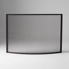 an empty black fireplace screen on a white background with copy space for text or image