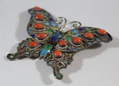 -Antique Chinese Sterling Silver Enamel Natural Tear Drop Orange Coral Butterfly Brooch -Total size: 2.25 in x 1.75 in -Coral size:about 5.35 mm x 4.4 mm -Total weight: 12 g -Marked silver Multicolor Cabochon Brooch For Gift, Multicolor Cabochon Brooch As Gift, Multicolor Cabochon Brooches As Gift, Multicolor Cabochon Brooches For Gifts, Victorian Style Multicolor Brooches As Gift, Antique Multicolor Brooch For Gifts, Antique Multicolor Brooches As Gifts, Hallmarked Enamel Brooches As Gifts, Hallmarked Enamel Brooches For Gifts