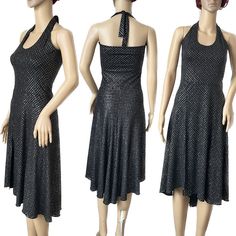 A tango halter neck dress made of a beautiful shimmery jersey with lycra. Black with silver glitter effect. This fabric shimmers as it moves around when worn. The skirt is shorter at the front with a split at the right side and the length graduates to a longer point at the back. The top of the dress is a halter neck with back ties. Top lined in black jersey with lycra. Ideal for special occasions. Measurements One only available in large size  Bust 98-116cm Waist 80-100cm Hips up to 136cm Length 100cm at front and 106cm at back longest point This garment can fit more than one size. If you have the smaller measurements this will be a loose fit. The larger measurements will be a tight fit. All length measurements are taken from the bottom of the waistband for skirts and from the inside leg f Tango Skirt, Tango Dress, Culotte Jumpsuit, Halter Neck Dress, Hip Ups, Black Jersey, Halterneck Dress, Dress Clothes For Women, Silver Glitter