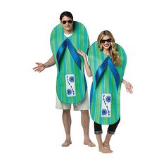 man and woman in matching beach towels with sunflowers on the front, one wearing sunglasses