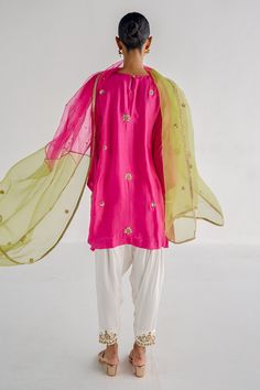 Pink kurta with floral zardosi, sequin embroidery. Paired with salwar and two tone organza dupatta.
Components: 3
Pattern: Embroidered
Type Of Work: Zardosi
Neckline: Round
Sleeve Type: Flared
Fabric: Silk, Cotton satin, Organza, Lining: Shantoon
Color: Pink
Other Details: 
Border detailing
Side slits
Embroidered two tone sheer dupatta
Occasion: Puja - Aza Fashions Designer Silk Salwar Kameez With Zari Work, Silk Traditional Wear With Gota Work For Party, Festive Silk Salwar Kameez With Zari Work, Designer Silk Kurta With Mirror Work, Designer Silk Kurta With Sheer Dupatta, Designer Silk Salwar Kameez, Designer Festive Silk Salwar Kameez, Designer Silk Salwar Kameez For Festive Occasions, Bollywood Style Silk Kurta With Zari Work