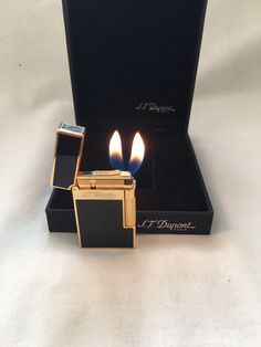 two lighters sitting next to each other in a box