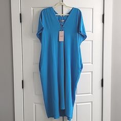 Bought This Dreamy Lightweight Summer Dress In The Uk In 2022. Super Flattering And Very Forgiving Of Areas You Might Not Like Like Your Stomach Or Thighs. If You're Not Familiar With What A Crescent / Dolman / Kaftan / Narrow Hem Batwing Dress Looks Like On, I'm Adding A Photos At The End In A Different Color So You Have An Idea. It Doesn't Fit Me Now, It's A Size L-Xl (So 14-16). I'm A 12 Now And It's Too Big (See Last Photo). Hangs Loose (It's Supposed To), Flowy Fabric, Moves Like A Dream. O Blue V-neck Maxi Dress For Daywear, Blue Oversized Maxi Dress With Short Sleeves, Oversized Blue Maxi Dress With Short Sleeves, Oversized Blue Midi Dress, Blue Relaxed Fit Dress For Loungewear, Relaxed Fit Blue Dress For Loungewear, Blue Oversized Short Sleeve Dress, Oversized Blue Short Sleeve Dress, Blue Relaxed Fit Maxi Dress For Daywear