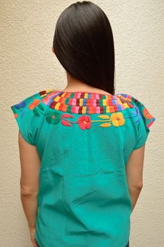 Magia Mexica Mexican Embroidered Blouses Women Blouse multicolored handmade by Mexican artisans. Measurements: ↕ 23 in ↔ 20 in WARRANTY We use what is needed to make your item arrives 100% safe and intact to your address. SHIPPING & DELIVERY TIMEFRAME We ship your order within 1-2 days after purchase USA: *Free Shipping USA 15-20 business days *Standard: 1 week * Express: 3 days Rest of the World: *Standard 4-6 weeks * Express: 5 days Every order is shipped within 1 business day Including IN Multicolor Cotton Tops For Cinco De Mayo, Cinco De Mayo Multicolor Cotton Tops, Folk Style Multicolor Tops For Cinco De Mayo, Multicolor Folk Tops For Cinco De Mayo, Multicolor Folk Tops With Woven Motifs, Folk Style Multicolor Tops With Woven Motifs, Green Cotton Top With Embroidered Neckline, Cinco De Mayo Multicolor Tops With Floral Embroidery, Casual Multicolor Tops With Embroidered Border