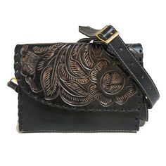 This rustic hand-tooled leather bag, with its exquisite chiseled artisan design, is the perfect accessory to add a touch of vintage elegance to your daily ensemble. Ideal for carrying all your essentials, this purse is lovingly handmade by skilled artisans, ensuring each piece is a unique work of art. 🌹height: 16 cm. 6.2  inches 🌹width : 22 cm.  8.5 inches 🌹base:5 cm.    2  inches Adjustable and detachable large strap:130 cm  51 inches interior: suede leather interior: 1 zippered  compartment Black Hand Tooled Rectangular Shoulder Bag, Black Hand Tooled Shoulder Bag For Everyday, Hand-tooled Rectangular Saddle Bag, Artisan Hand Tooled Black Bag, Black Hand Tooled Artisan Bag, Black Artisan Hand-tooled Bag, Artisan Hand-tooled Black Bag, Artisan Black Hand-tooled Bag, Artisan Shoulder Bag With Engraved Details For Everyday Use