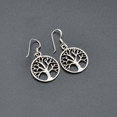 Tree of Life Silver Earrings - 925 Sterling Silver Dangle Earrings - Circle of Life Jewelry - Nature-Inspired Tree Earrings Embrace the beauty of nature with these exquisite Tree of Life Silver Earrings. Crafted from high-quality 925 sterling silver, these dangle earrings feature a stunning tree design that symbolizes growth, strength, and the interconnectedness of all life. Perfect for nature lovers and those who appreciate meaningful jewelry. Features: Material :  925 Sterling Silver,  Earring Tree Jewelry, Tree Earrings, Meaningful Jewelry, Earring Tree, Jewelry Tree, Sterling Silver Dangle Earrings, Circle Of Life, Silver Earring, Tree Designs