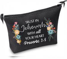 a black zippered pouch with flowers and the words trust in jehoush with all your heart proves 3 5