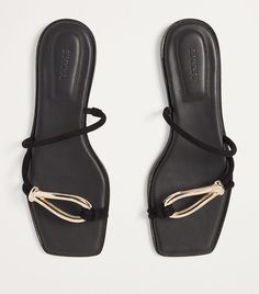 Find SIMKHAI Leather Love Knot Sandals on Editorialist. Simkhais sandals are quickly earning their status as timeless summer staples. The Love Knot pair, finished with gold-tone detailing on the front of each strap, should be kept particularly close-by so that when the tropics call your name, you're always ready. Initial Jewelry, Love Knot