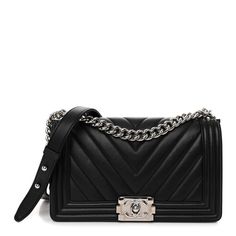 This is an authentic CHANEL Calfskin Chevron Quilted Medium Boy Flap in Black. This chic shoulder bag is crafted of chevron-quilted calfskin leather in black. It features a silver chain-link shoulder strap with a leather shoulder pad and a matching boy CC push lock on the front. This opens the bag to a grey fabric interior with a patch pocket. Grey Chanel Boy Bag, Chanel Boy Bag Chevron, Chanel Evening Bags, Chanel Handbags Black, Structured Shoulder, Boy Black, Classic Flap Bag, Perfect Handbag, Woman Bags Handbags